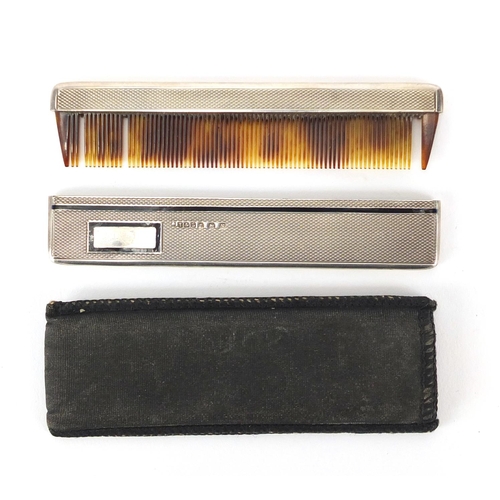 282 - Silver and faux tortoiseshell comb with black enamel and engine turned decoration, Birmingham hallma... 