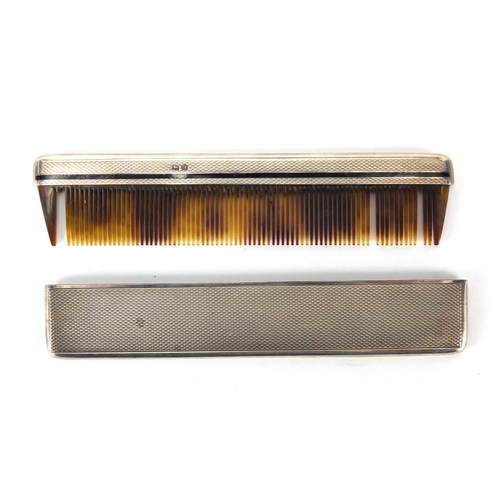 282 - Silver and faux tortoiseshell comb with black enamel and engine turned decoration, Birmingham hallma... 