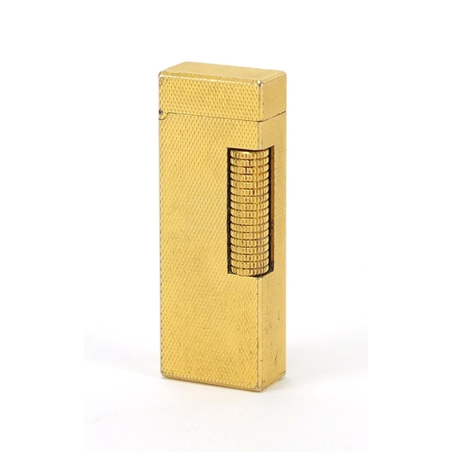 386 - Dunhill gold plated pocket lighter, with engine turned decoration, 6.5cm in length