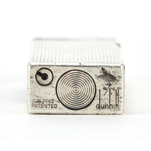 387 - Dunhill silver plated pocket lighter, with engine turned decoration, 6.5cm in length