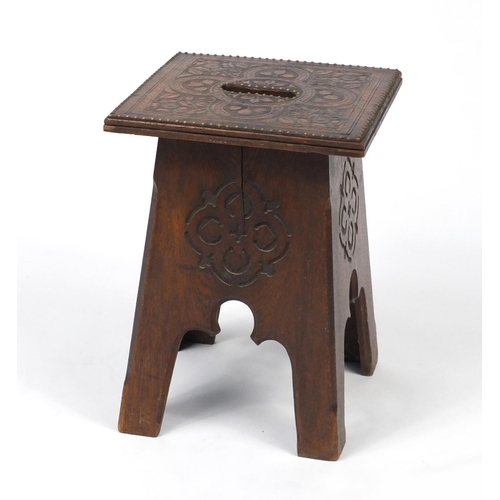 22 - Carved oak stool with tooled leather top, 42cm H x 30cm W x 30cm D