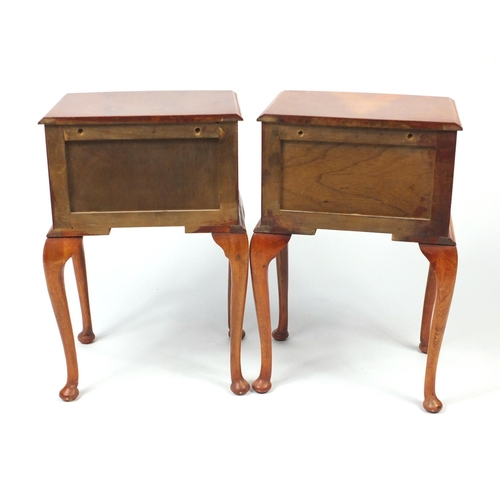25 - Two yew bow front bedside chests, raised on cabriole legs, 66cm H x 42cm W x 33cm D