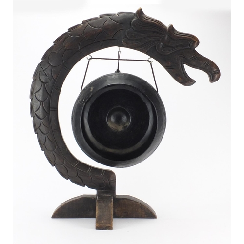 2102 - Chinese carved hardwood dragon design gong, 65cm high