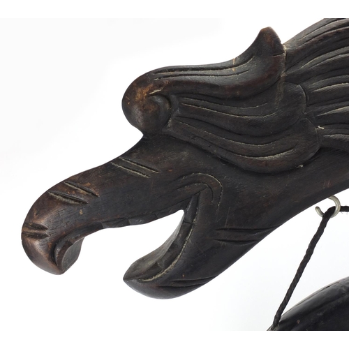 2102 - Chinese carved hardwood dragon design gong, 65cm high