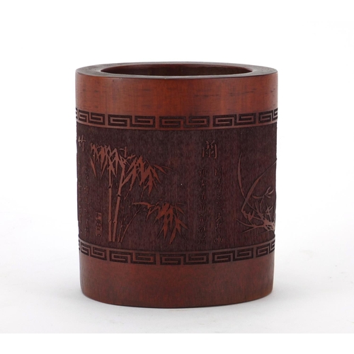 2043 - Chinese bamboo brush pot, carved with trees and calligraphy, 12cm high