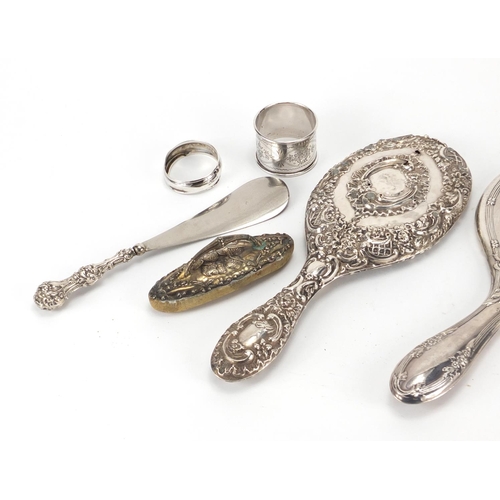 2250 - Silver objects including two dressing table hand mirrors, silver handled button hooks, shoe horn and... 