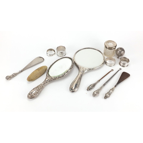 2250 - Silver objects including two dressing table hand mirrors, silver handled button hooks, shoe horn and... 