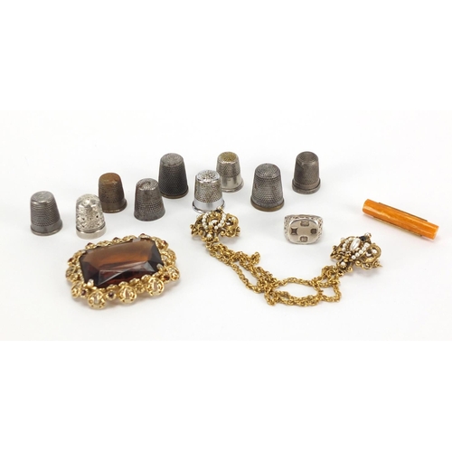 410 - Costume jewellery including a silver signet ring, butterscotch amber brooch, large citrine style bro... 