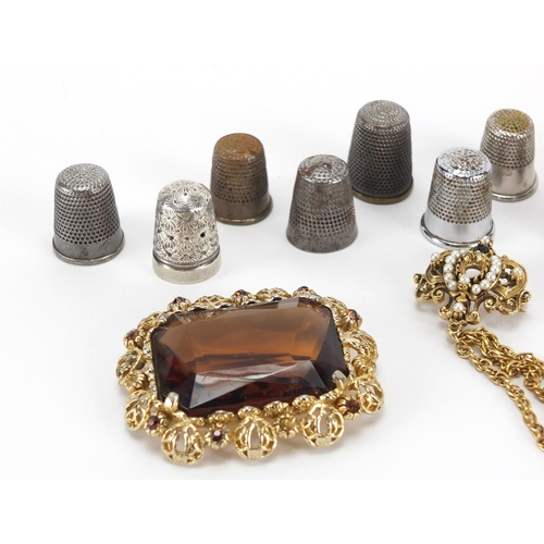 410 - Costume jewellery including a silver signet ring, butterscotch amber brooch, large citrine style bro... 
