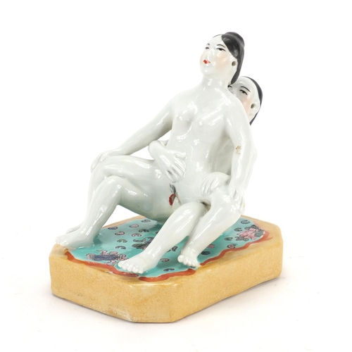 2075 - Chinese porcelain model of an erotic couple, 17.5cm high