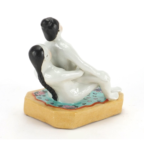 2075 - Chinese porcelain model of an erotic couple, 17.5cm high