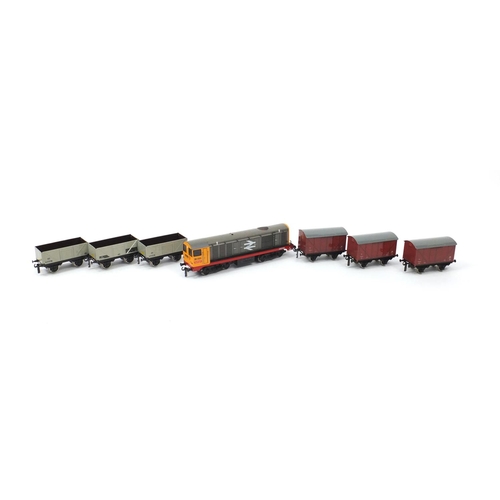 2157 - Bassett-Lowke O gauge tin plate with boxes, comprising class twenty diesel locomotive and set of thr... 