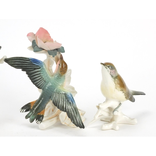 142 - Four Karl Ens china bird groups, the largest 14cm high