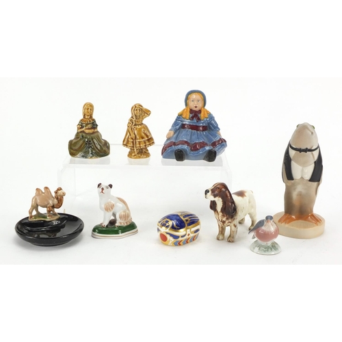 422 - China figures and animals including a Wade fish waiter, Beswick spaniel and Royal Crown Derby Millen... 