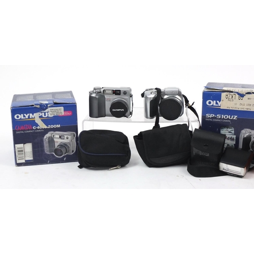 210 - Three Olympus digital cameras