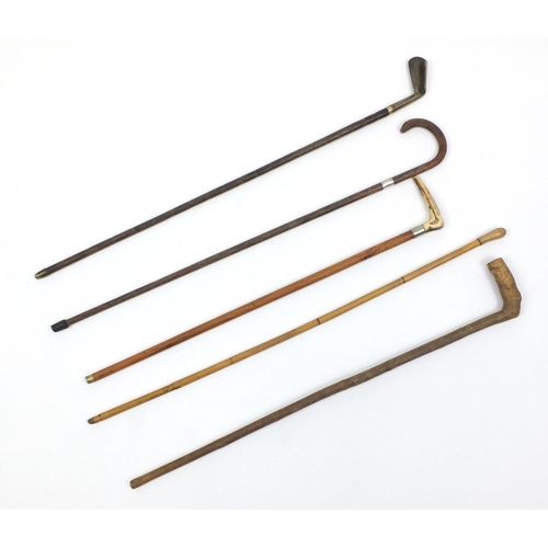 288 - Five walking sticks, one with horn handle and brass gold club handle