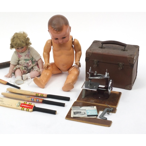 546 - Vintage and later toys including miniature signed cricket bats, large composite doll and a child's s... 