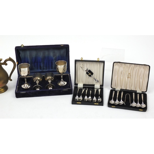 207 - Metalwares including cased sets of silver plated cutlery and a brass coffee pot