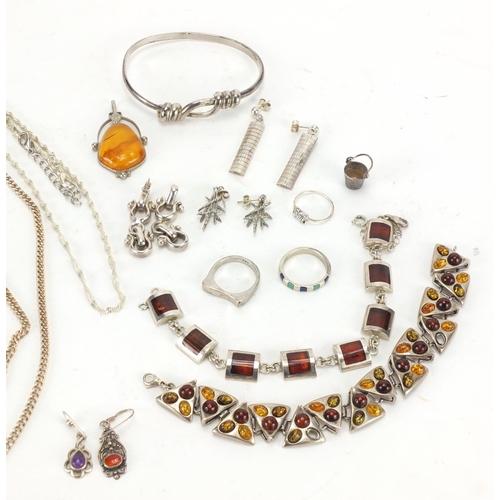 217 - Silver and white metal jewellery, some set with amber including necklaces, bracelets and earrings, a... 