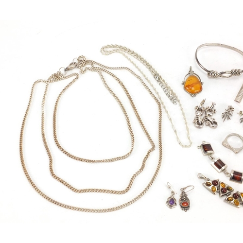 217 - Silver and white metal jewellery, some set with amber including necklaces, bracelets and earrings, a... 