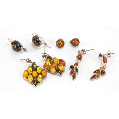 229 - Four pairs of silver and white metal earrings set with amber coloured cabochon stones, approximate w... 
