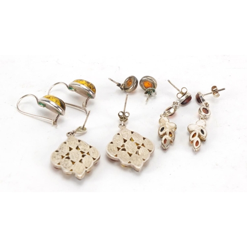 229 - Four pairs of silver and white metal earrings set with amber coloured cabochon stones, approximate w... 