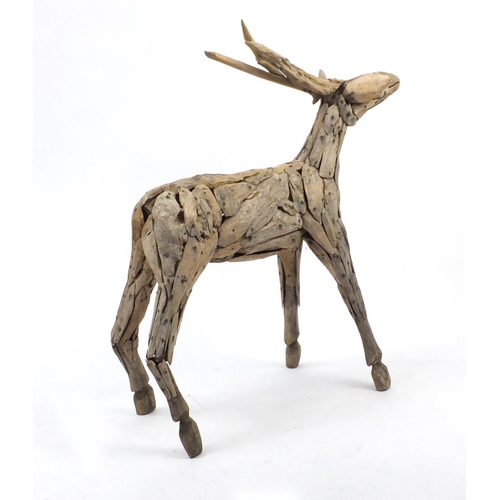 27 - Naturalistic wooden model of a deer, 107cm high