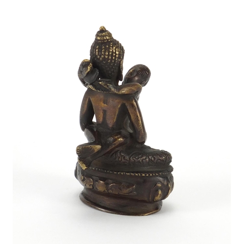 400 - Bronzed metal Thai Buddha and child, 9.5cm high