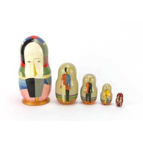 94 - Set of five Russian Matryoshka stacking dolls with abstract design, the largest 17.5cm high