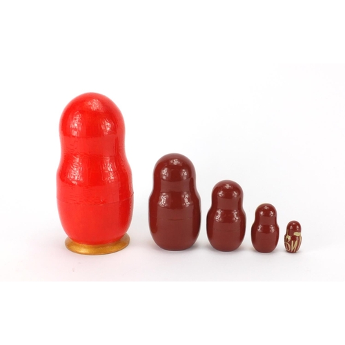94 - Set of five Russian Matryoshka stacking dolls with abstract design, the largest 17.5cm high