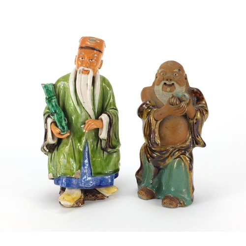 96 - Two Chinese hand painted pottery figures, the largest 17.5cm high