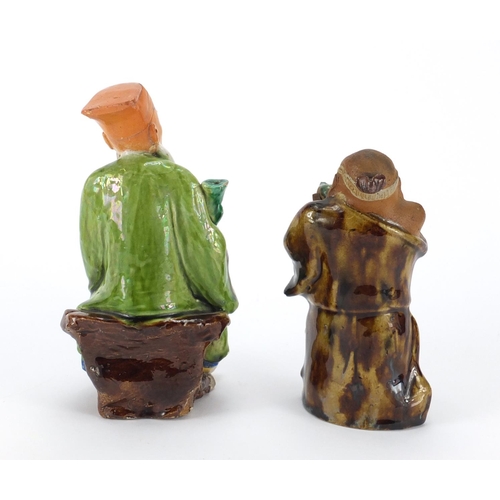 96 - Two Chinese hand painted pottery figures, the largest 17.5cm high