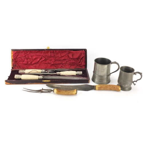 99 - Two steel bladed carving sets and two pewter tankards