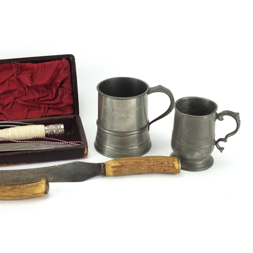 99 - Two steel bladed carving sets and two pewter tankards