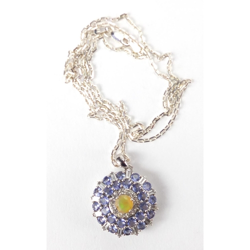 215 - Sterling silver tanzanite, Ethiopian opal and white topaz pendant on a silver necklace, with certifi... 