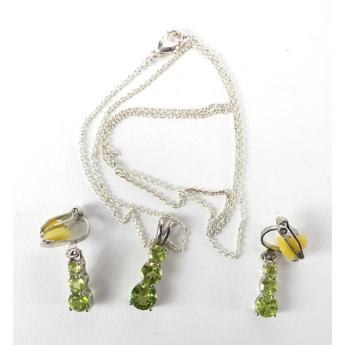 219 - Sterling silver American peridot pendant on chain and matching earrings and certificate, approximate... 