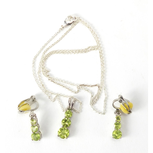 219 - Sterling silver American peridot pendant on chain and matching earrings and certificate, approximate... 