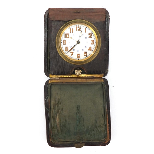 255 - Vintage leather cased travel alarm clock, with enamelled dial