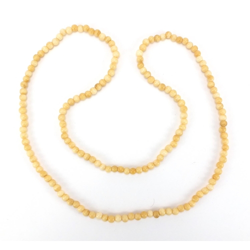 226 - Ivory style bead necklace, 106cm in length,  approximate weight 73.0g