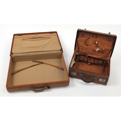 560 - Vintage brown leather suitcase and travelling vanity case, the largest 65cm wide