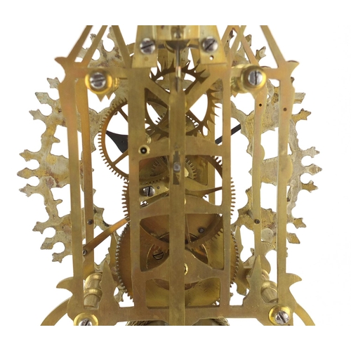 2145 - Brass skeleton clock with fusee movement, raised on an oval marble base, 39cm high