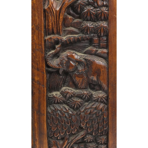 9 - African hardwood two door cupboard, carved with elephants amongst trees, 102cm H x 58cm W x 33cm D