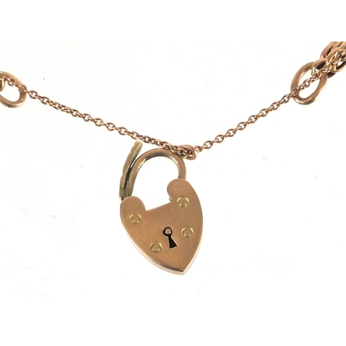 2267 - 9ct gold three row rose gold gate bracelet with love heart shaped padlock, 18cm in length, approxima... 