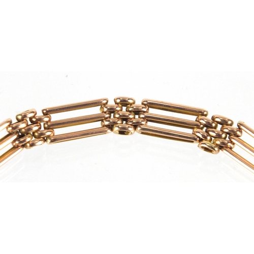 2267 - 9ct gold three row rose gold gate bracelet with love heart shaped padlock, 18cm in length, approxima... 