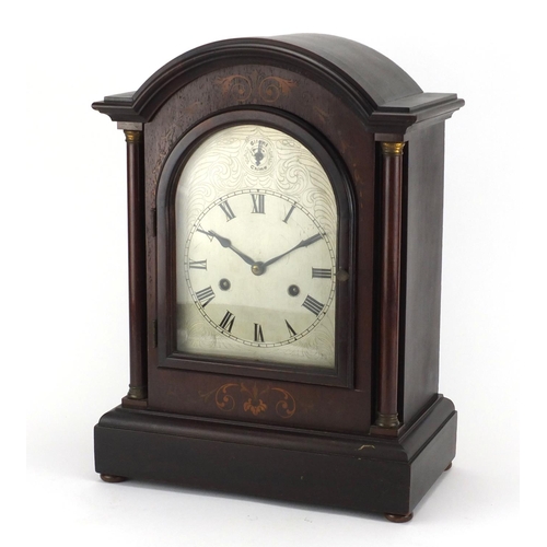 2140 - Inlaid mahogany striking mantle clock, with silvered dial and Roman numerals, 42.5cm high