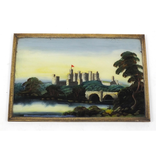 429 - Reverse glass painting of a fisherman seated before a castle, framed, 60cm x 40cm