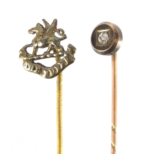 2341 - Unmarked gold diamond tie pin and a gilt metal Military example, the largest 5cm in length