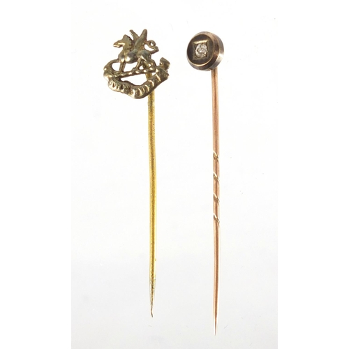 2341 - Unmarked gold diamond tie pin and a gilt metal Military example, the largest 5cm in length