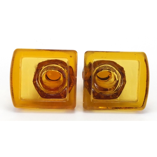 80 - Pair of Art Deco amber glass owl bookends, 14.5cm high