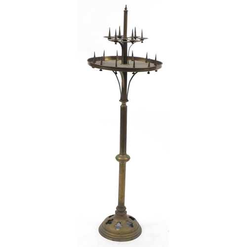 16 - 19th century brass Gothic style floor standing candelabra, approximately 133cm high